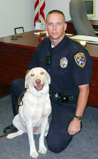 Bandera Police Department Officer Allen Kelley with his K9 drug dog, Madison.