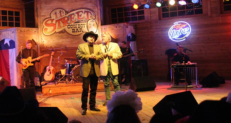 Moe Bandy and Joe Stampley perform at the 11th Street Cowboy Bar stage for New Year's Eve.